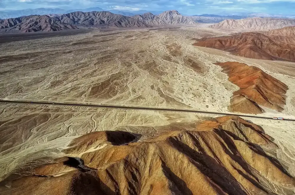 The Nazca desert with the Pan-American Highway crossing it, seen from a light aircraft