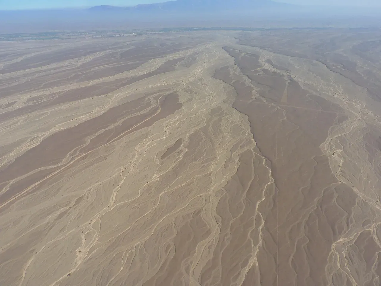 Lines and geoglyphs scratched across the desert plain of Nazca and Palpa