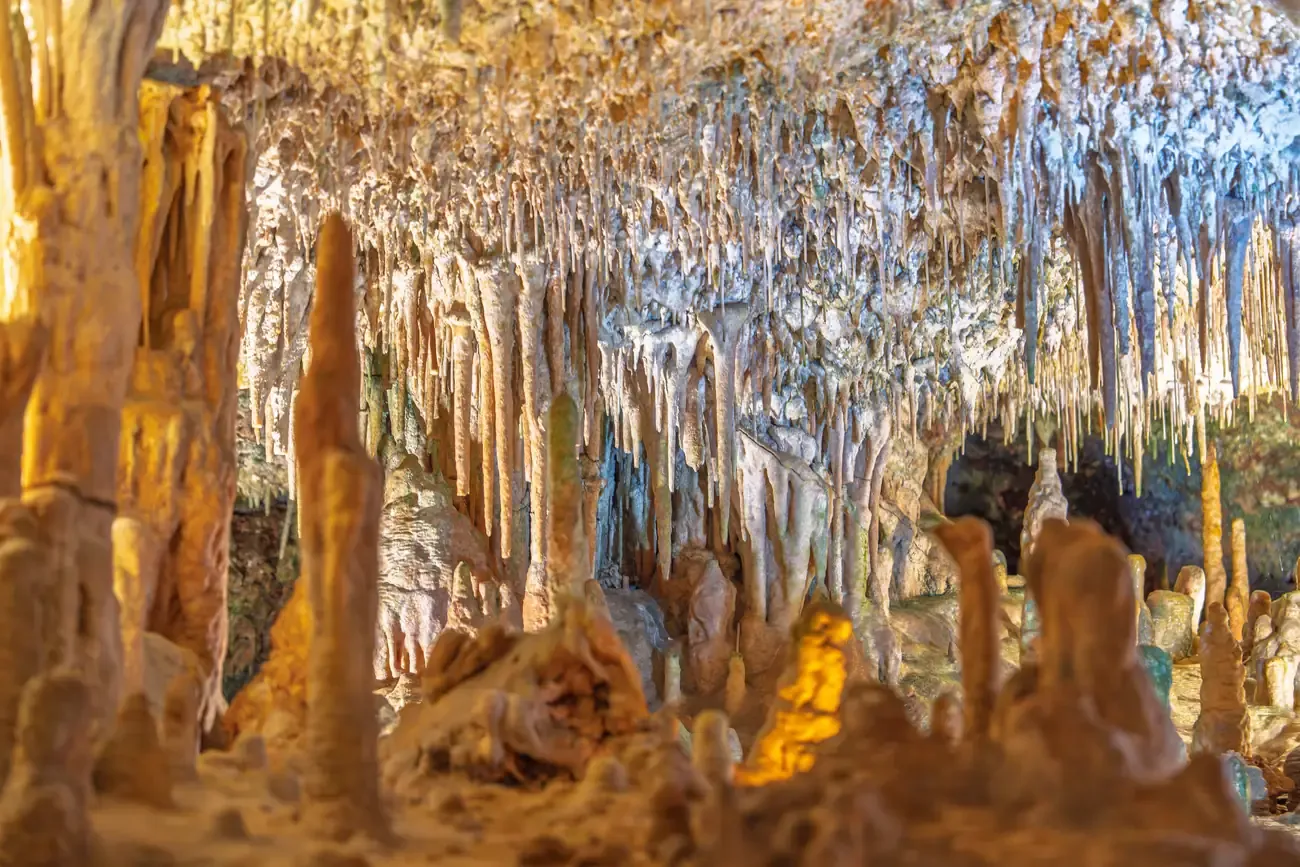 Illuminated stalactites and stalagmites inside the Nerja Caves, Malaga