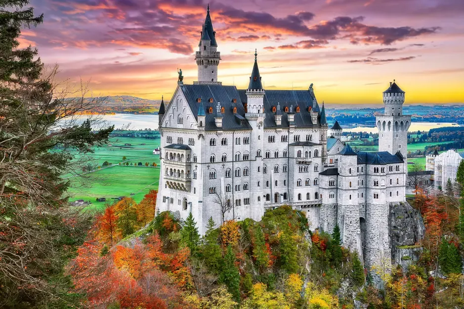 Neuschwanstein Castle surrounded by autumn foliage