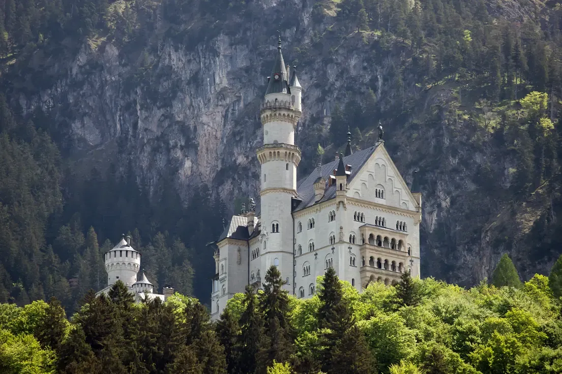 Neuschwanstein Castle with the Bavarian Alps in the background