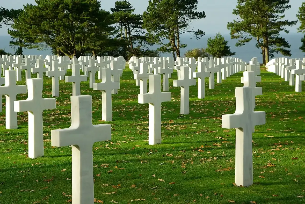 Rows of white headstones at the Normandy American Cemetery above Omaha Beach