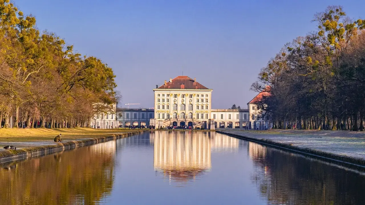 Nymphenburg Palace reflected in its canal in autumn in Munich