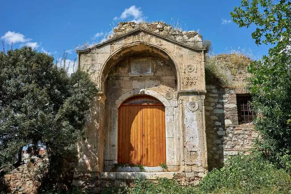 The surviving Ottoman gateway of the Old Madrasa with its wooden door beside the Roman Agora in Plaka, Athens
