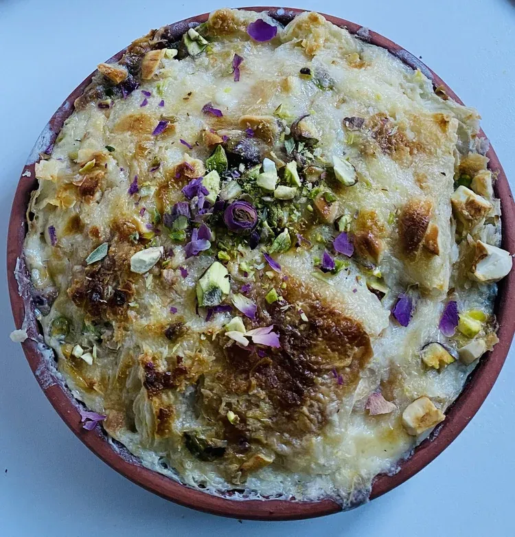 Om Ali, the Egyptian bread pudding, baked with nuts and raisins