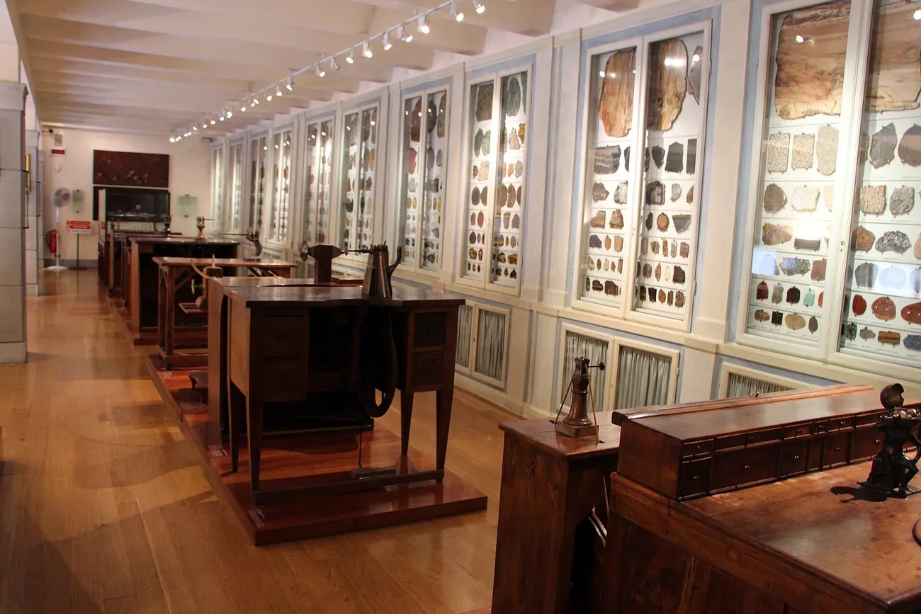 Historic stone-cutting workbenches and cabinets of stone samples in the Opificio delle Pietre Dure museum in Florence