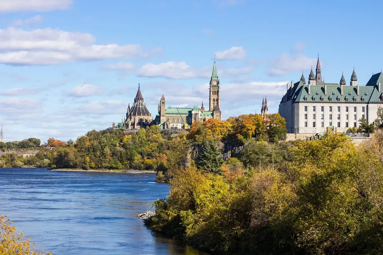 Parliament Hill seen across the Ottawa River in autumn