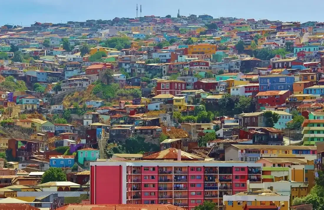 Brightly painted houses stacked on the hills of Valparaíso, Chile