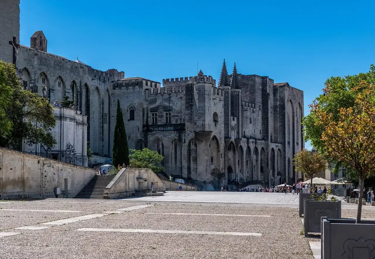 The Palais des Papes seen across the Place du Palais in Avignon, France