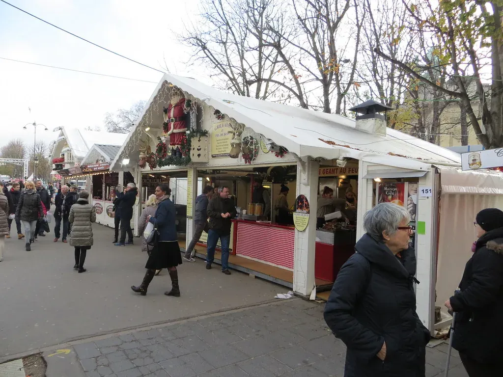 White Christmas market chalets along the Avenue des Champs-Elysees in Paris
