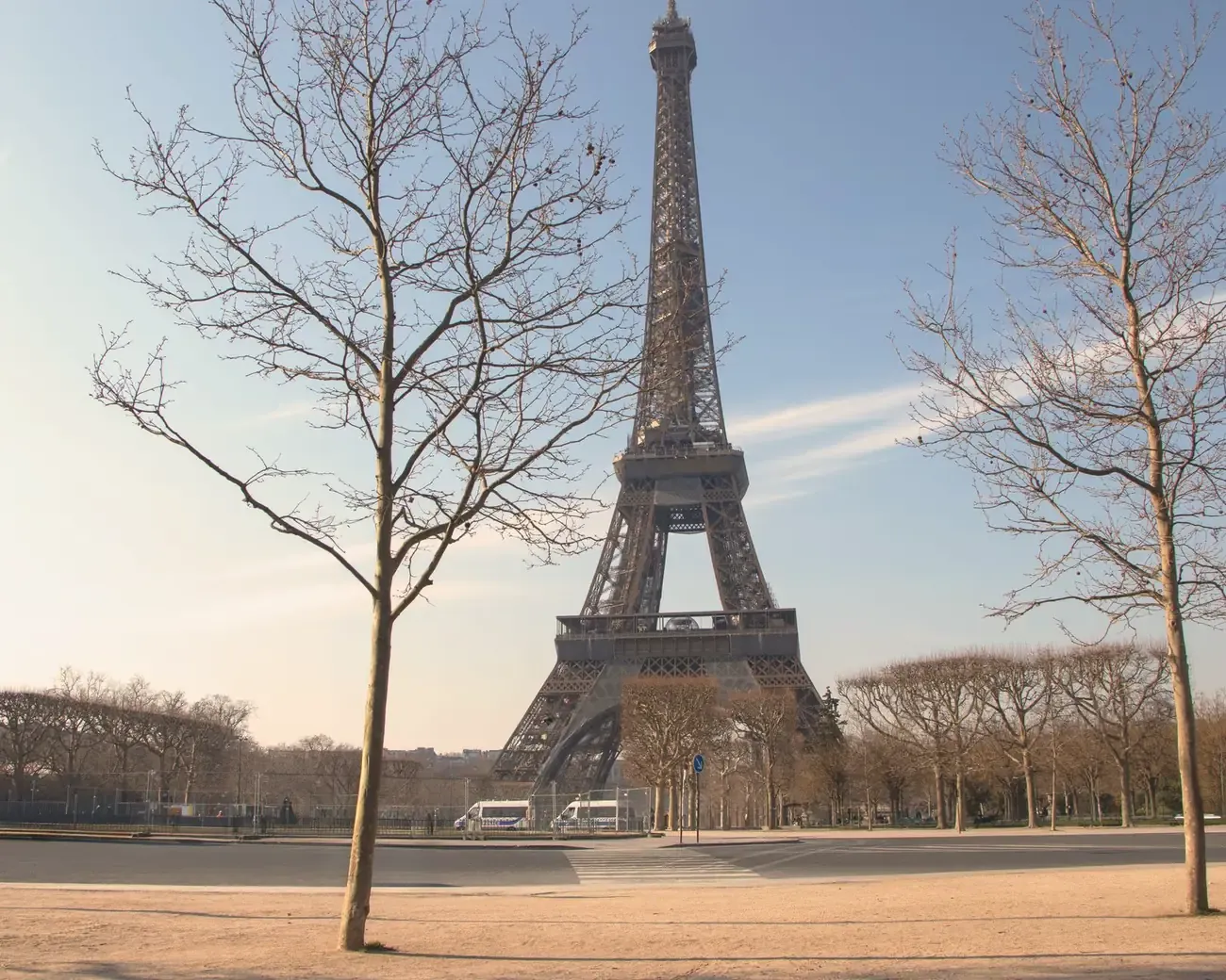 The Eiffel Tower in Paris framed by bare winter trees