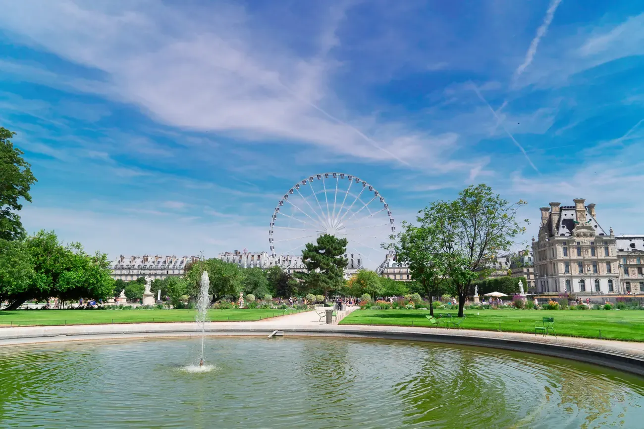 Lawn of the Tuileries Garden with a Ferris wheel in summer, Paris