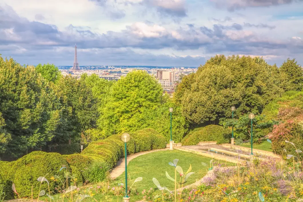 View over the rooftops of Paris to the Eiffel Tower from the gardens of Parc de Belleville