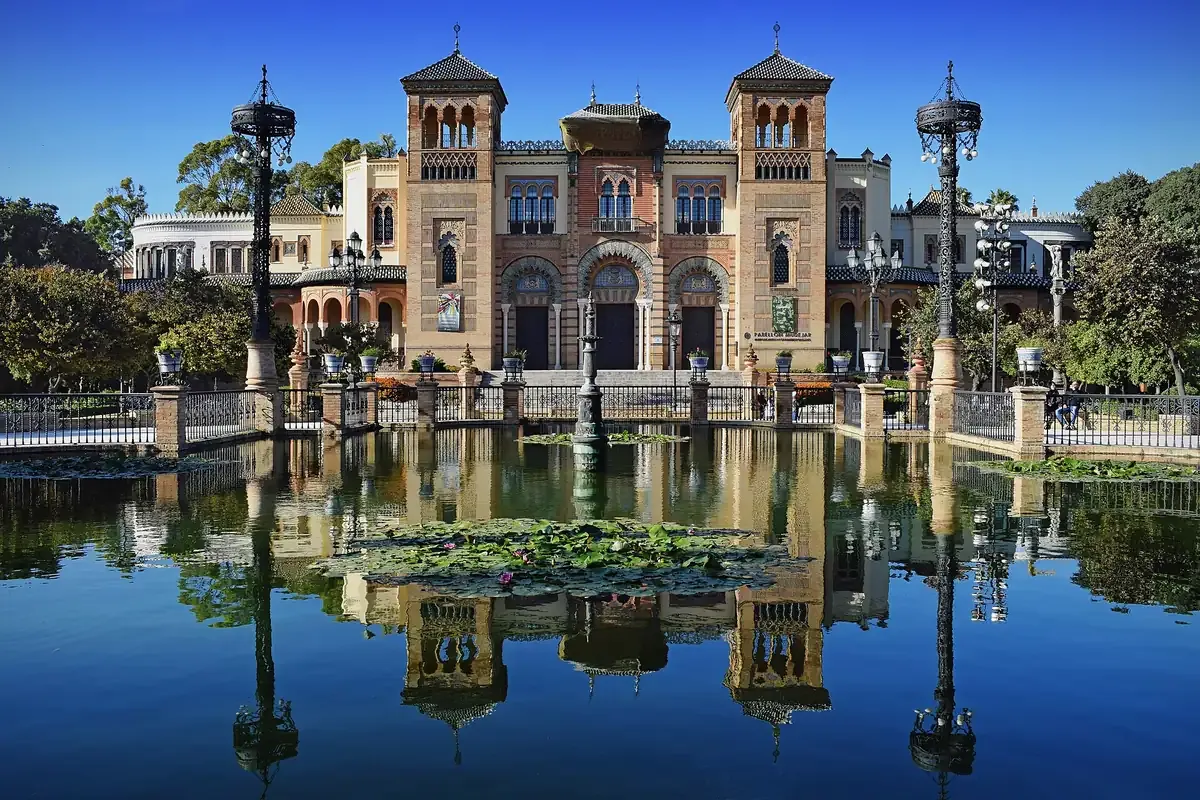 The Mudejar Pavilion reflected in the pond of the Parque de Maria Luisa in Seville