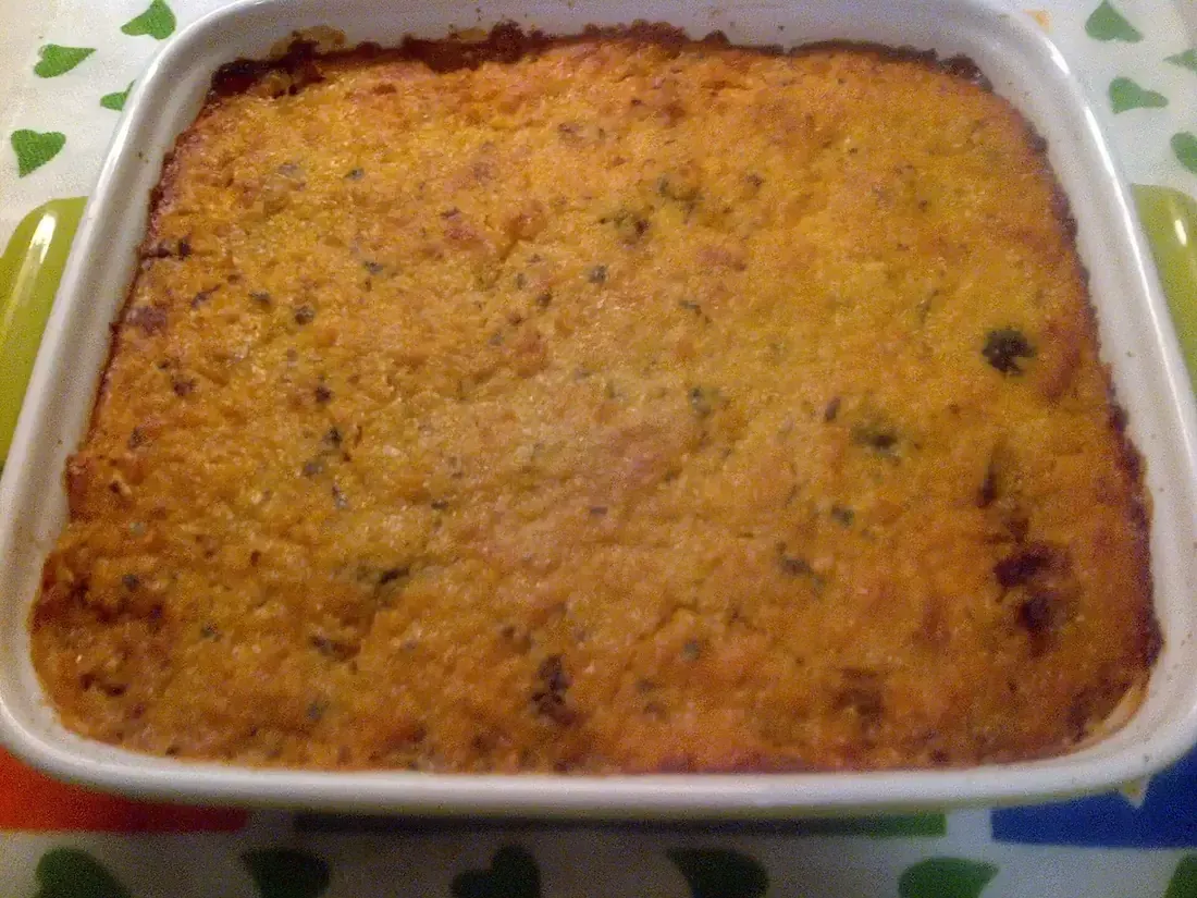 A pastel de choclo with its golden corn crust baked in a tray, Chile