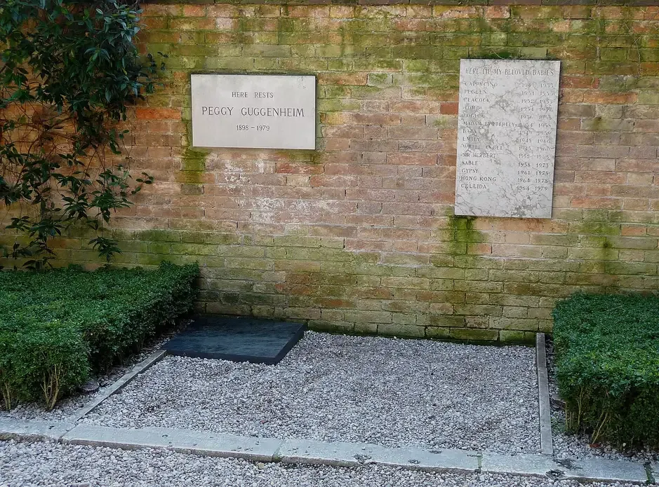 Peggy Guggenheim's grave plaque and the memorial plaque for her dogs in the garden of the Palazzo Venier dei Leoni in Venice