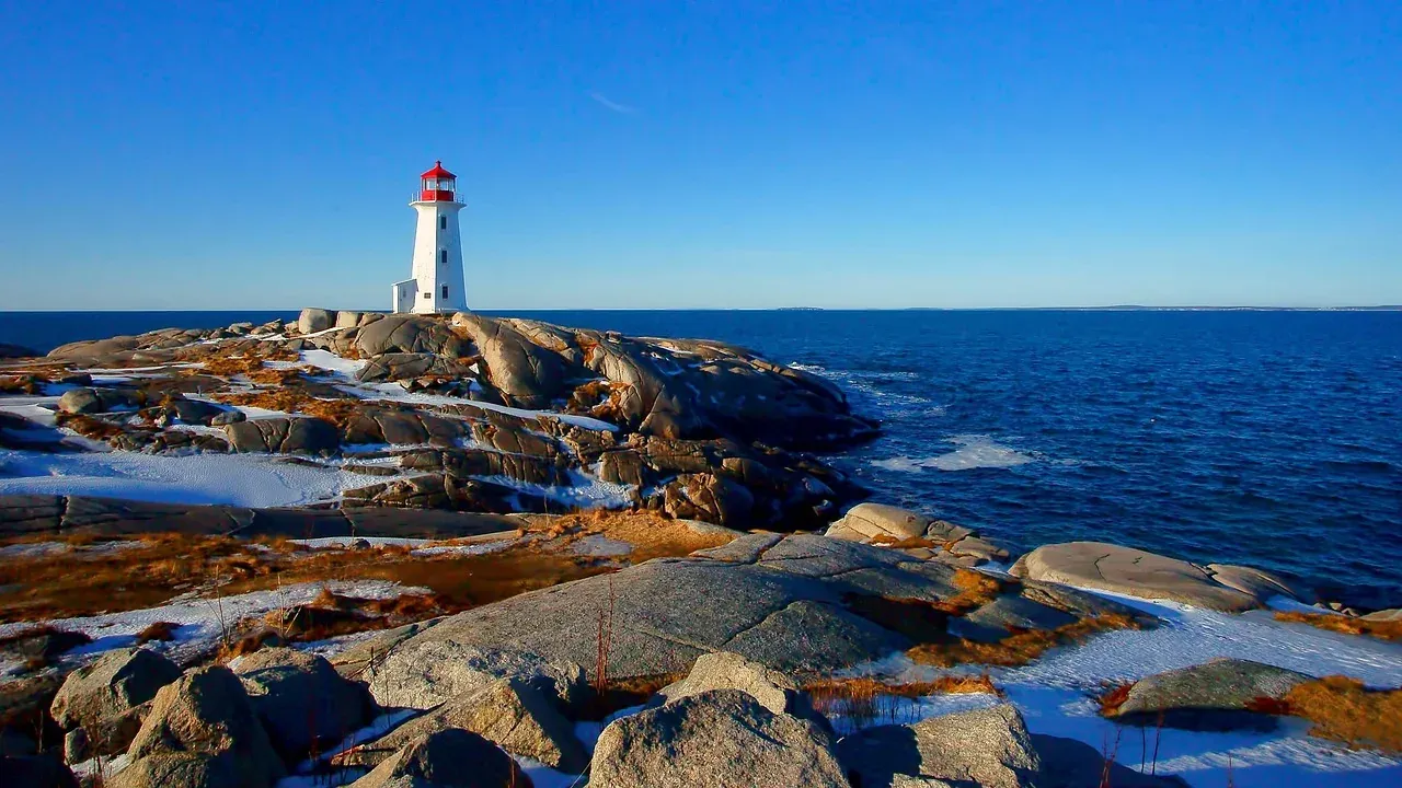 Peggys Point Lighthouse on the granite shore at Peggys Cove, Nova Scotia