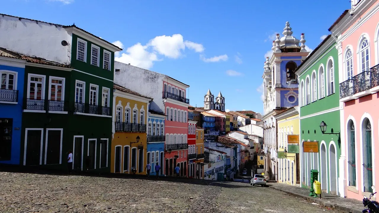 Coloured houses and a church tower on a square in Pelourinho, Salvador