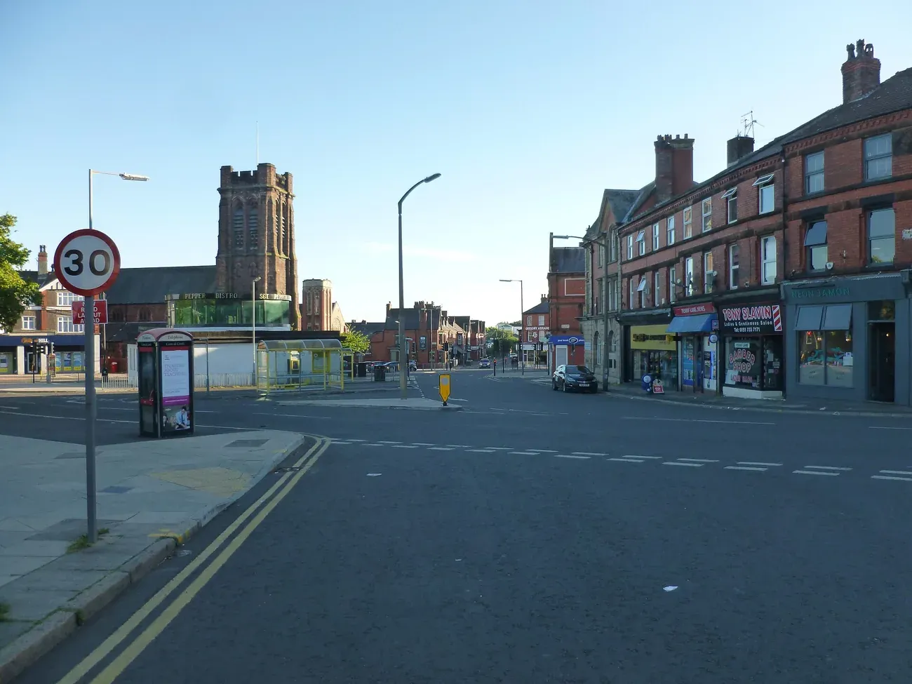Penny Lane looking along the road towards the church tower in Mossley Hill, Liverpool