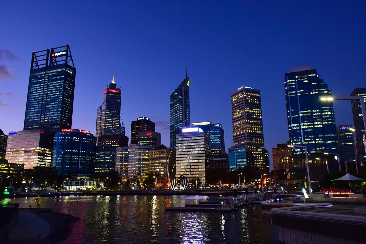 The Perth skyline lit up across the Swan River in Western Australia