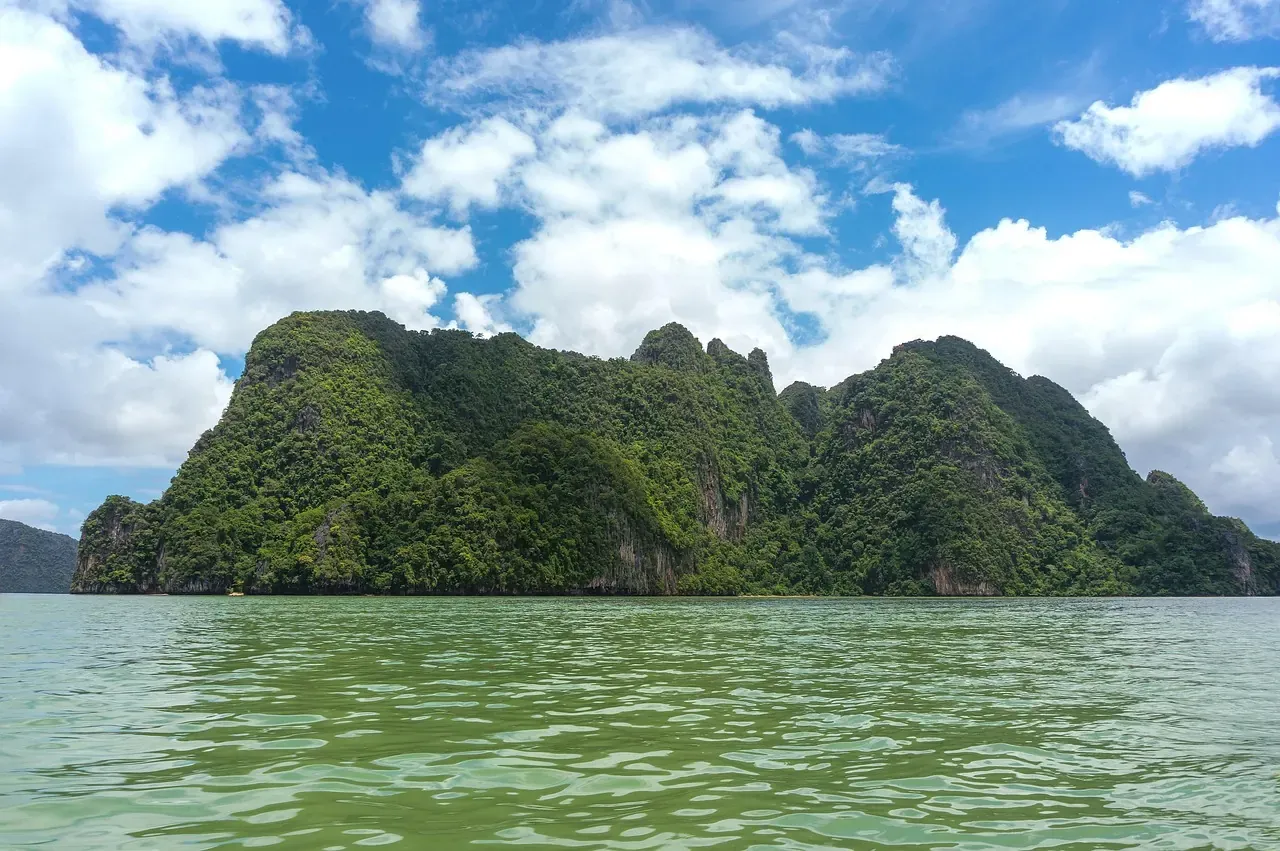 Limestone islands rising from the water of Phang Nga Bay