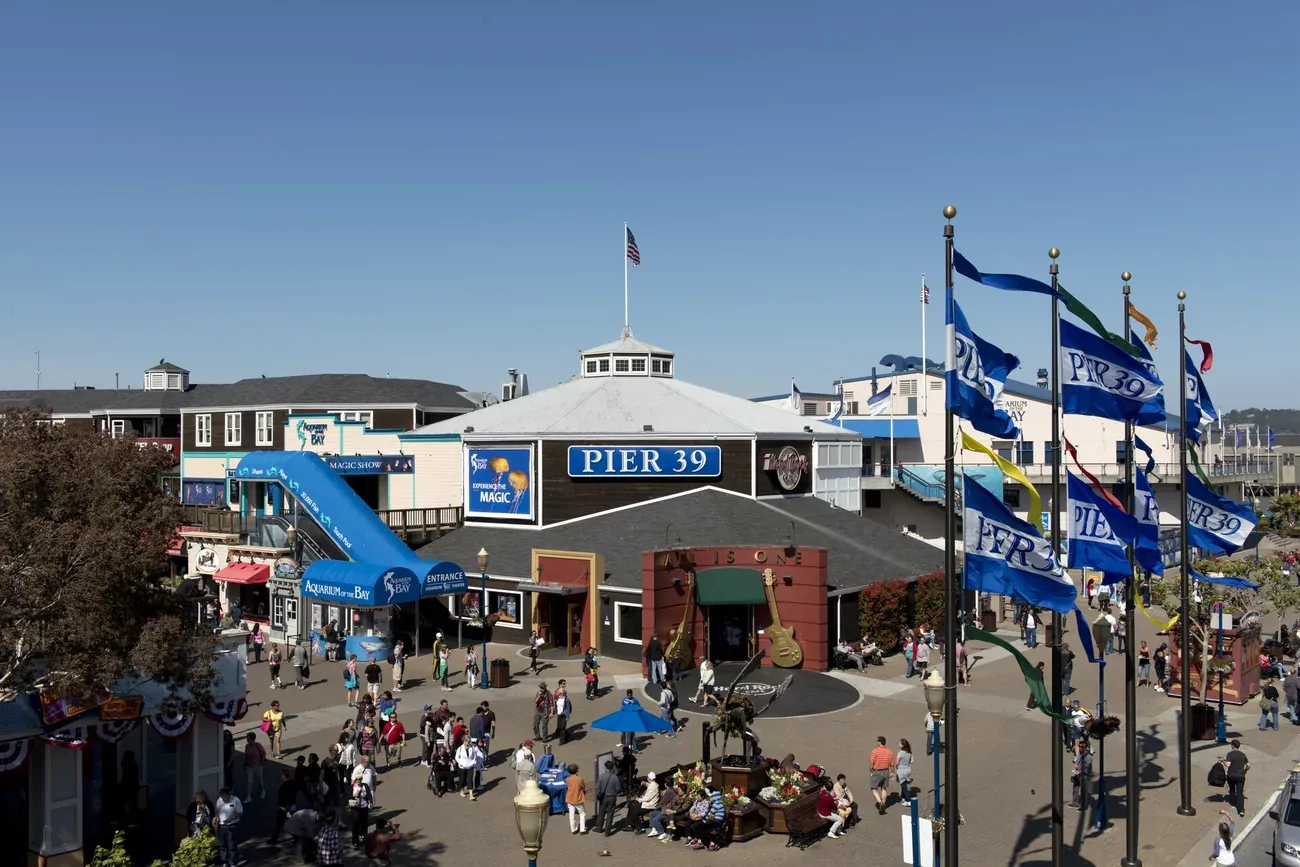 The Pier 39 entrance and its flags at Fisherman's Wharf in San Francisco