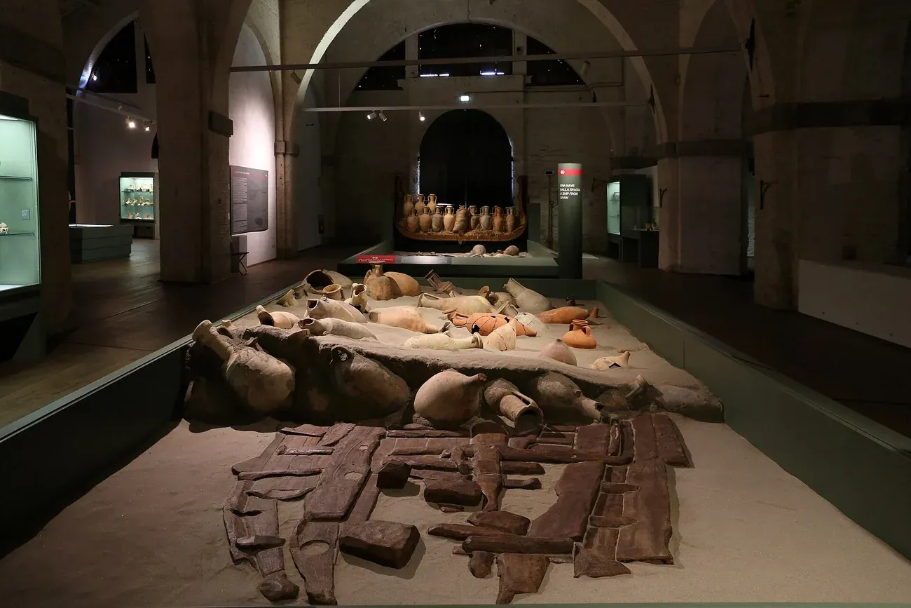 A Roman shipwreck with its cargo of amphorae in the Museum of the Ancient Ships of Pisa