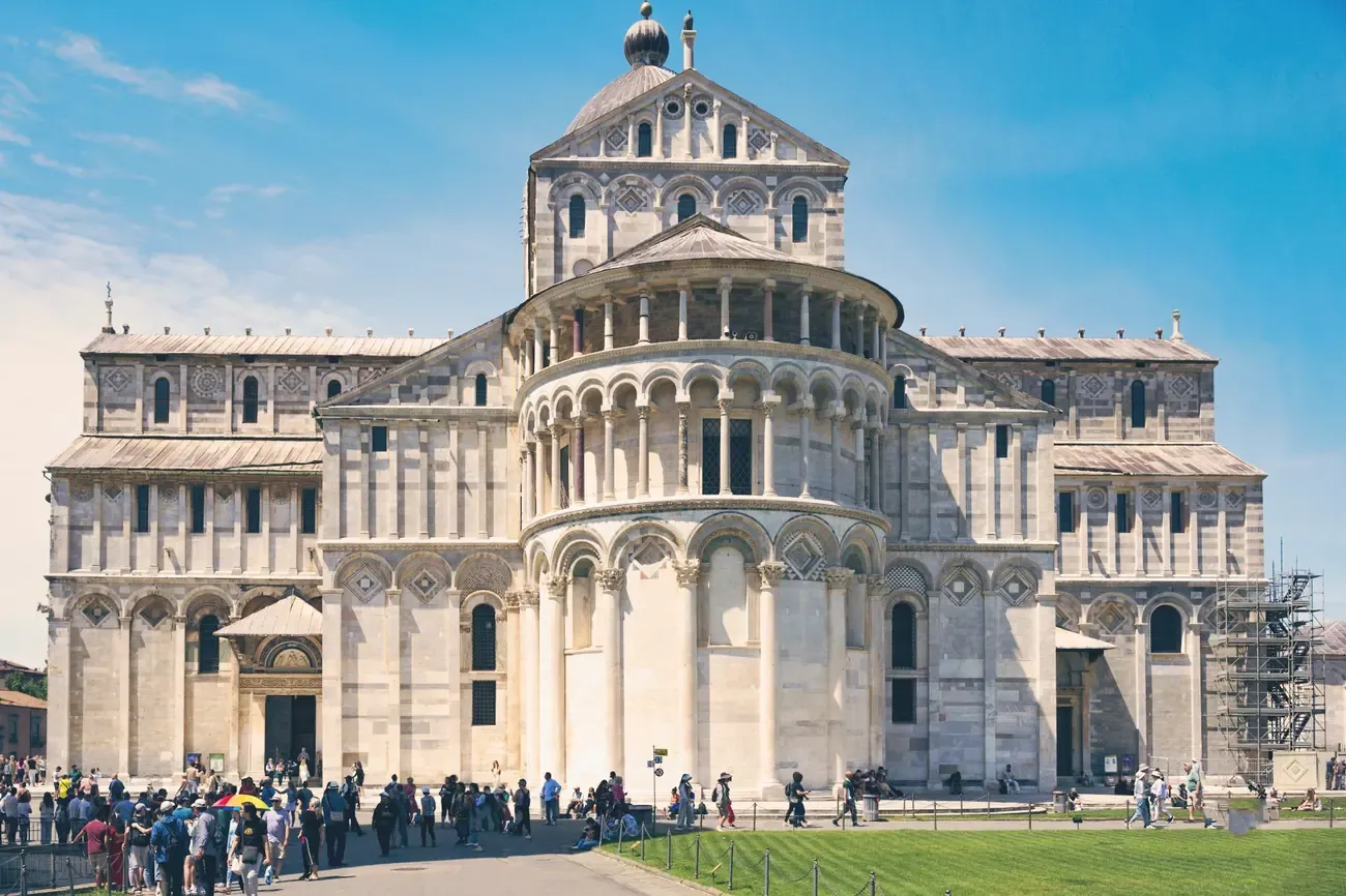 The transept and apse of Pisa Cathedral seen from the lawn of the Piazza dei Miracoli