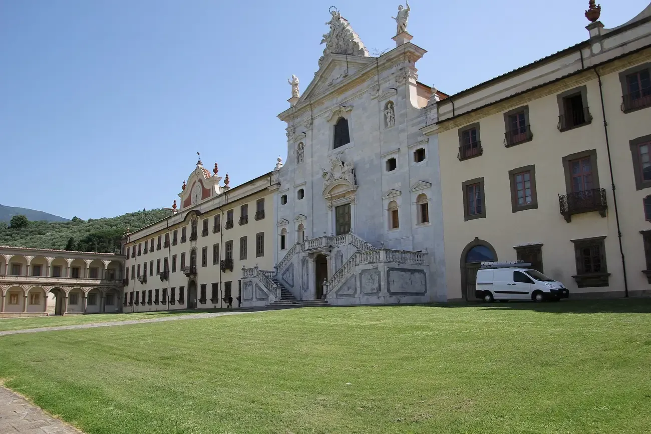 The baroque church facade and great courtyard of the Certosa di Calci near Pisa