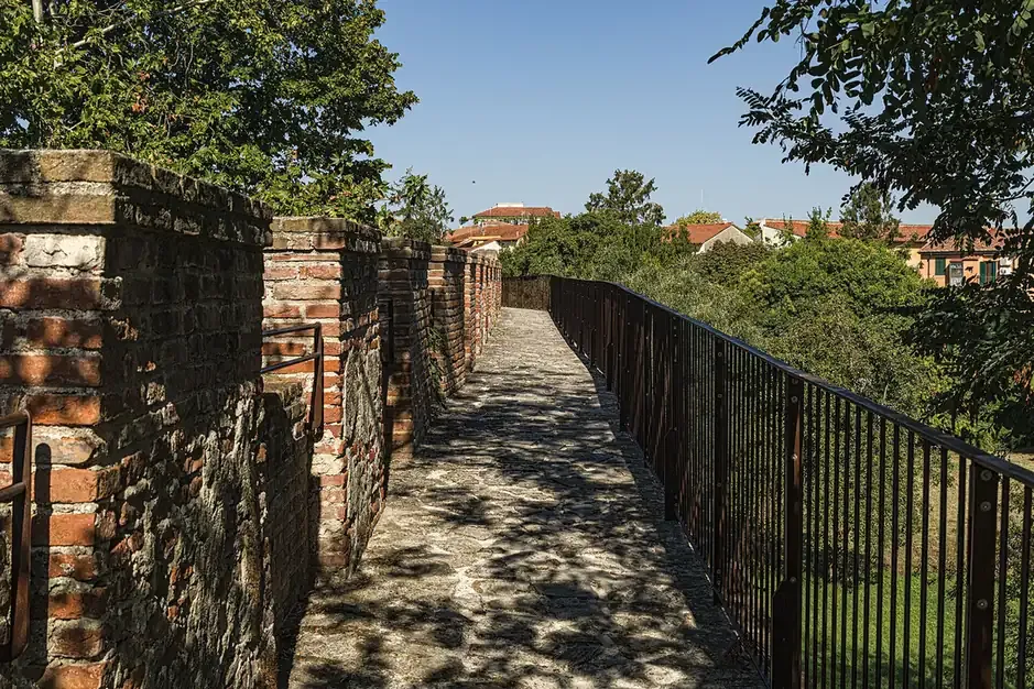 The walkway along the top of the medieval city walls of Pisa