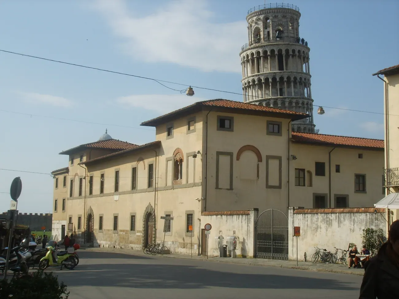 The Museo dell'Opera del Duomo building with the Leaning Tower behind it in Pisa