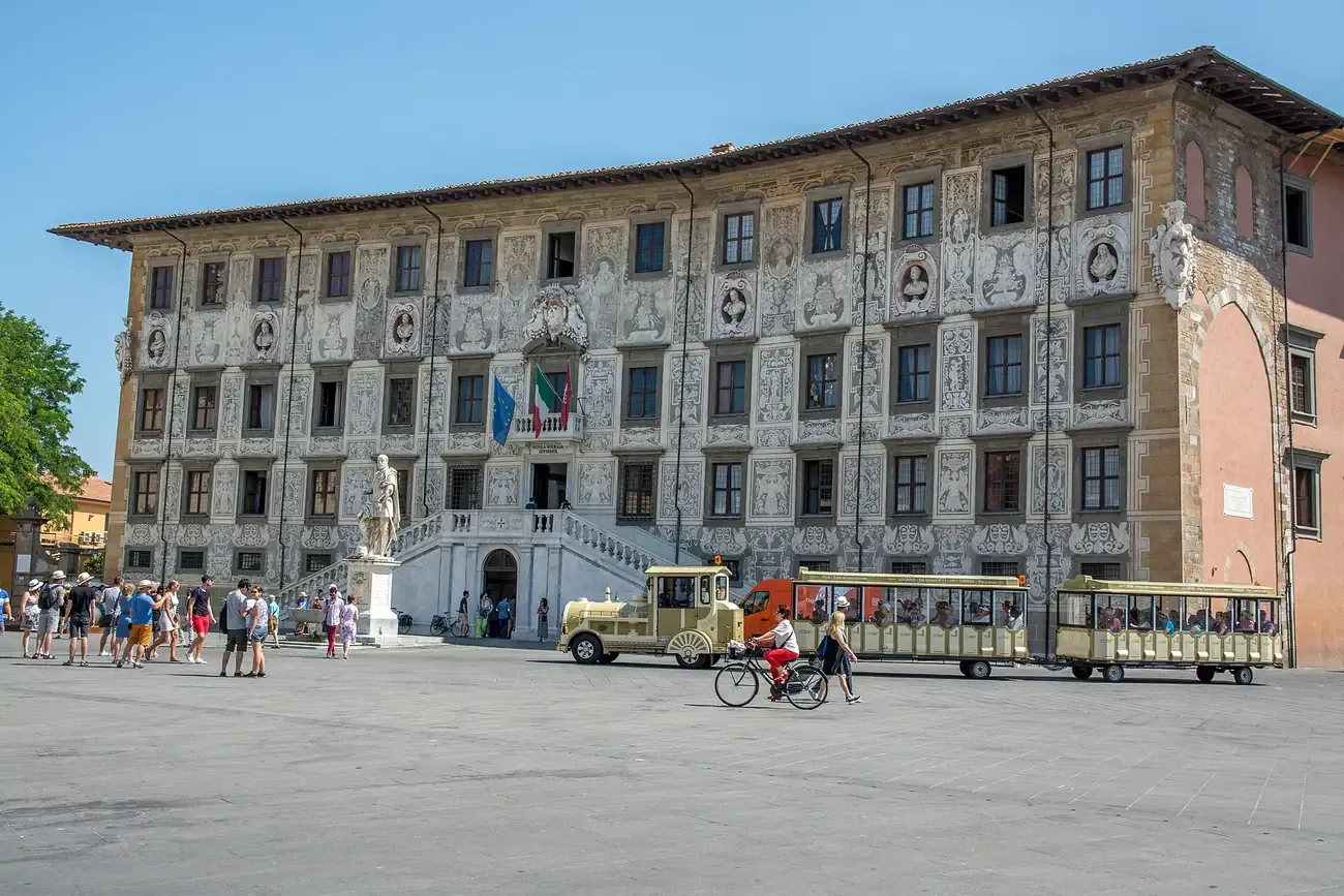 The sgraffito-decorated facade of the Palazzo della Carovana on Piazza dei Cavalieri in Pisa