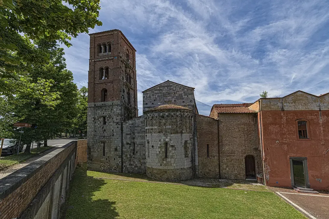 The leaning brick bell tower and apse of San Michele degli Scalzi in Pisa