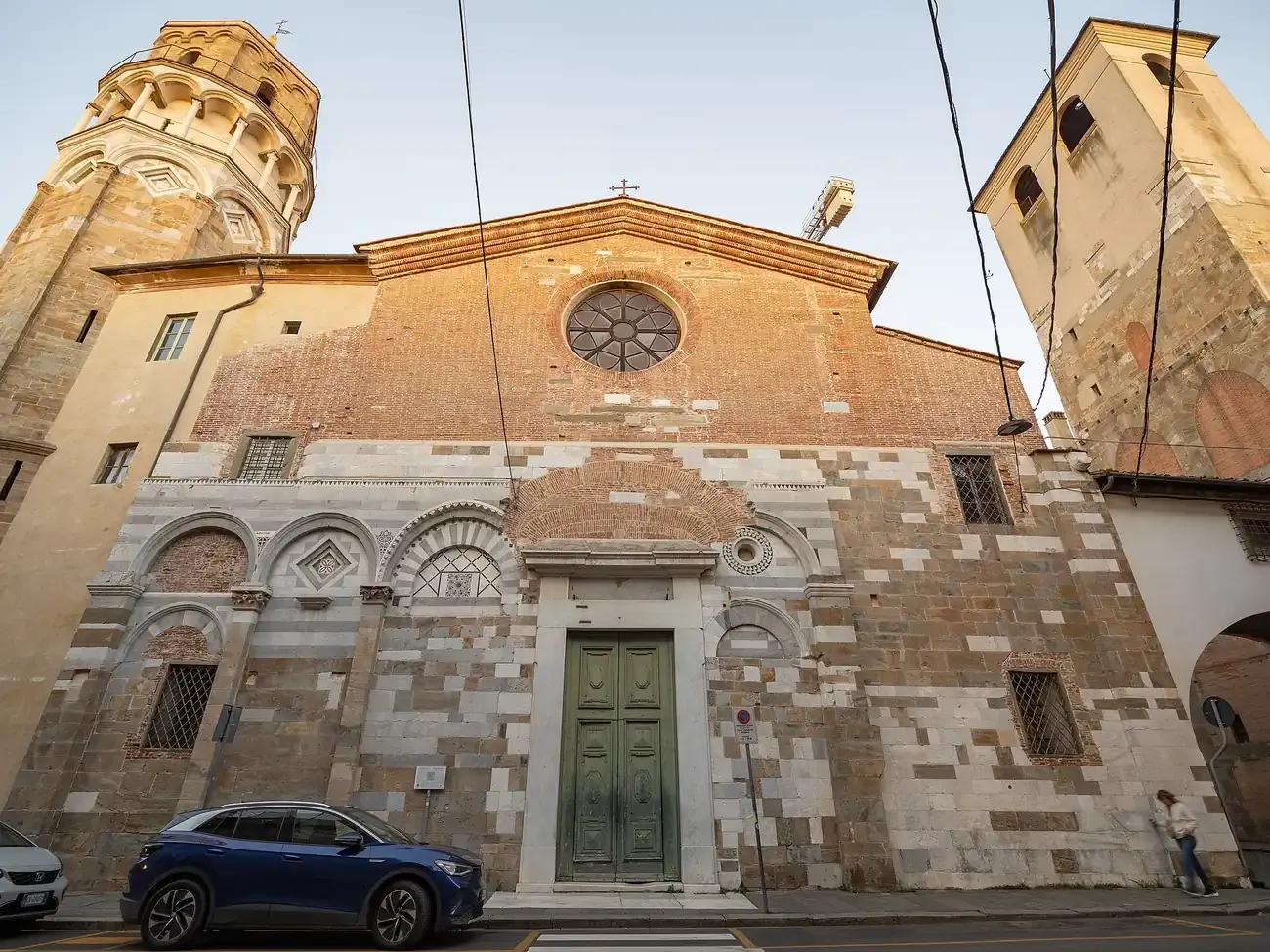 The facade of San Nicola church in Pisa with its leaning bell tower