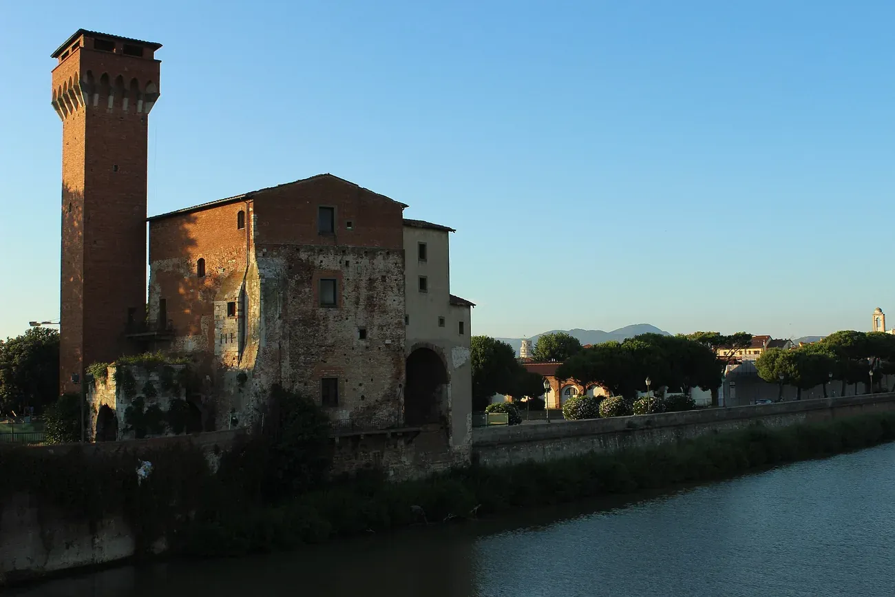 The Torre Guelfa and the Cittadella Vecchia on the bank of the Arno in Pisa
