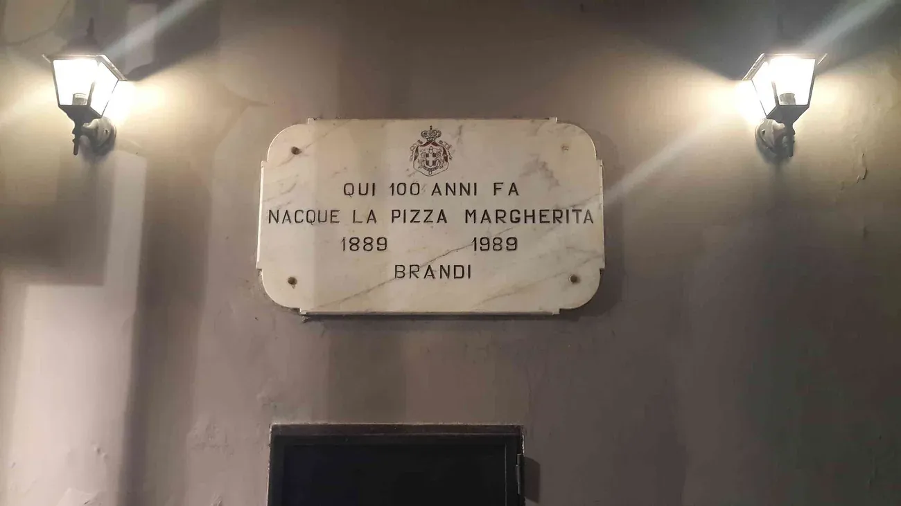 The marble plaque at Pizzeria Brandi in Naples marking the birth of the pizza Margherita in 1889