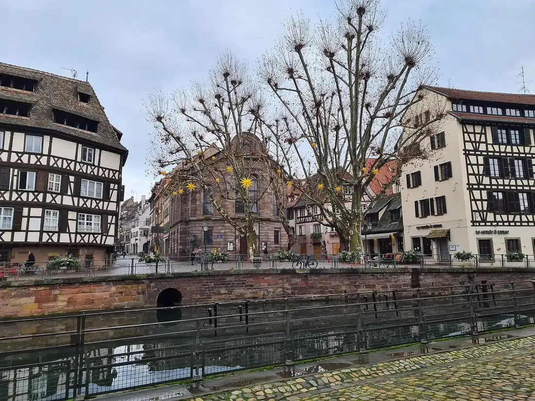 Half-timbered houses on place Benjamin-Zix in the Petite France quarter of Strasbourg, seen across the canal