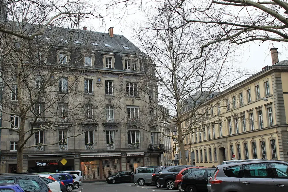 Stone apartment buildings on place du Temple-Neuf in Strasbourg in winter
