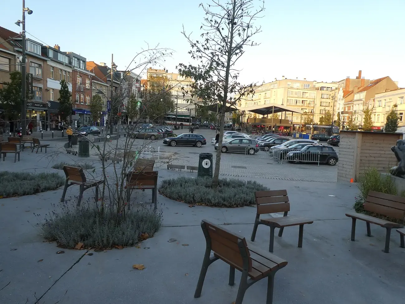 The Place Dumon in Stockel, Woluwe-Saint-Pierre, with benches and planted beds
