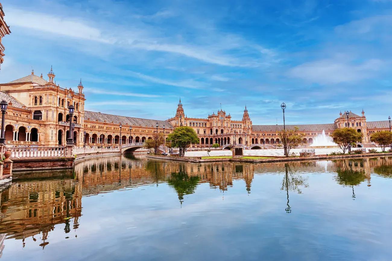 Plaza de Espana in Seville reflected in its canal