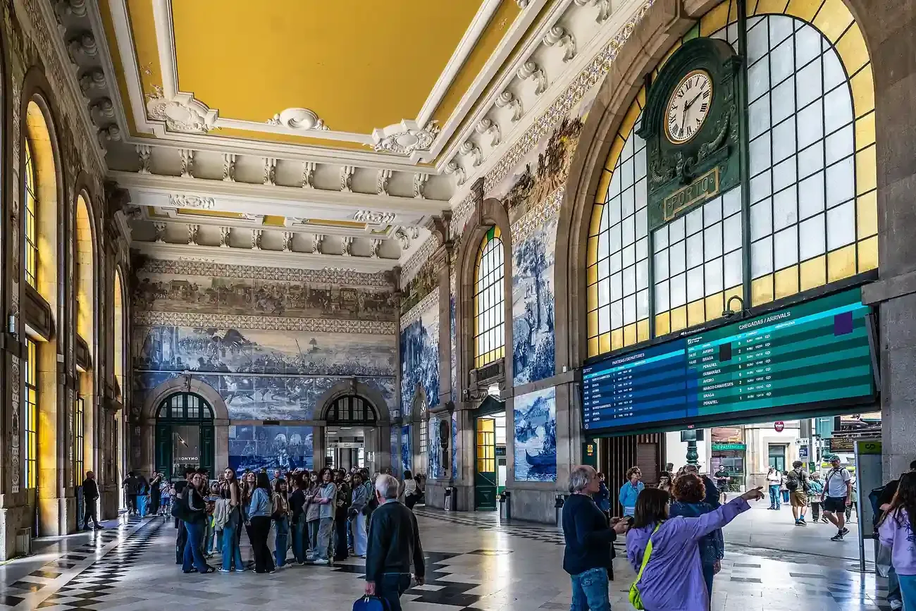 Azulejo panels and the clock in the entrance hall of Sao Bento station in Porto
