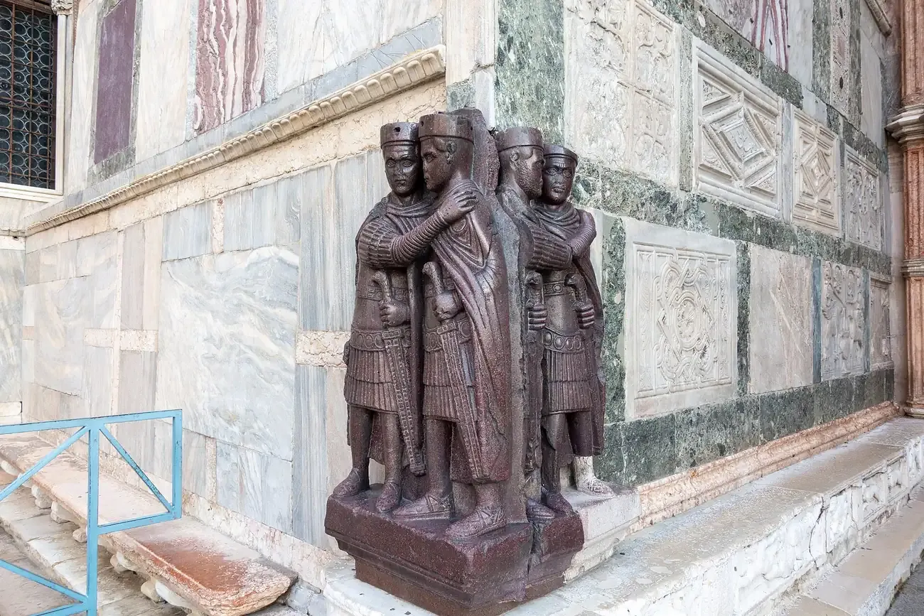 The porphyry sculpture of the Four Tetrarchs embedded in the corner of St Mark's Basilica in Venice