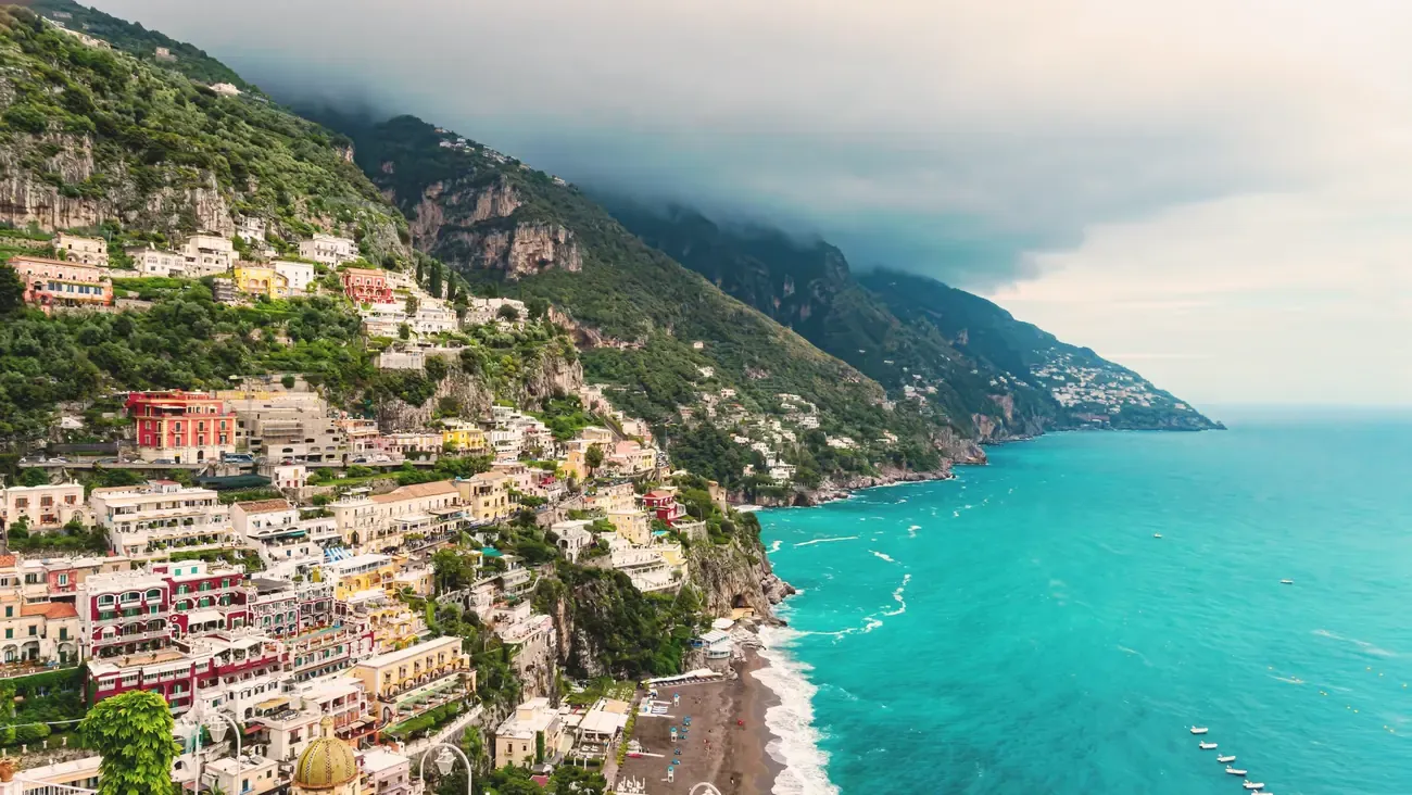 Aerial view of Positano's colorful cliffside houses above the sea, Amalfi Coast, Italy