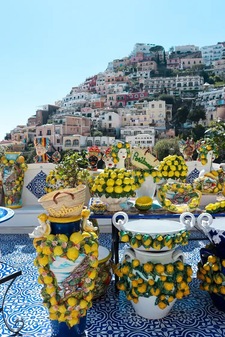 Hand-painted lemon ceramics for sale with a view over Positano's hillside houses