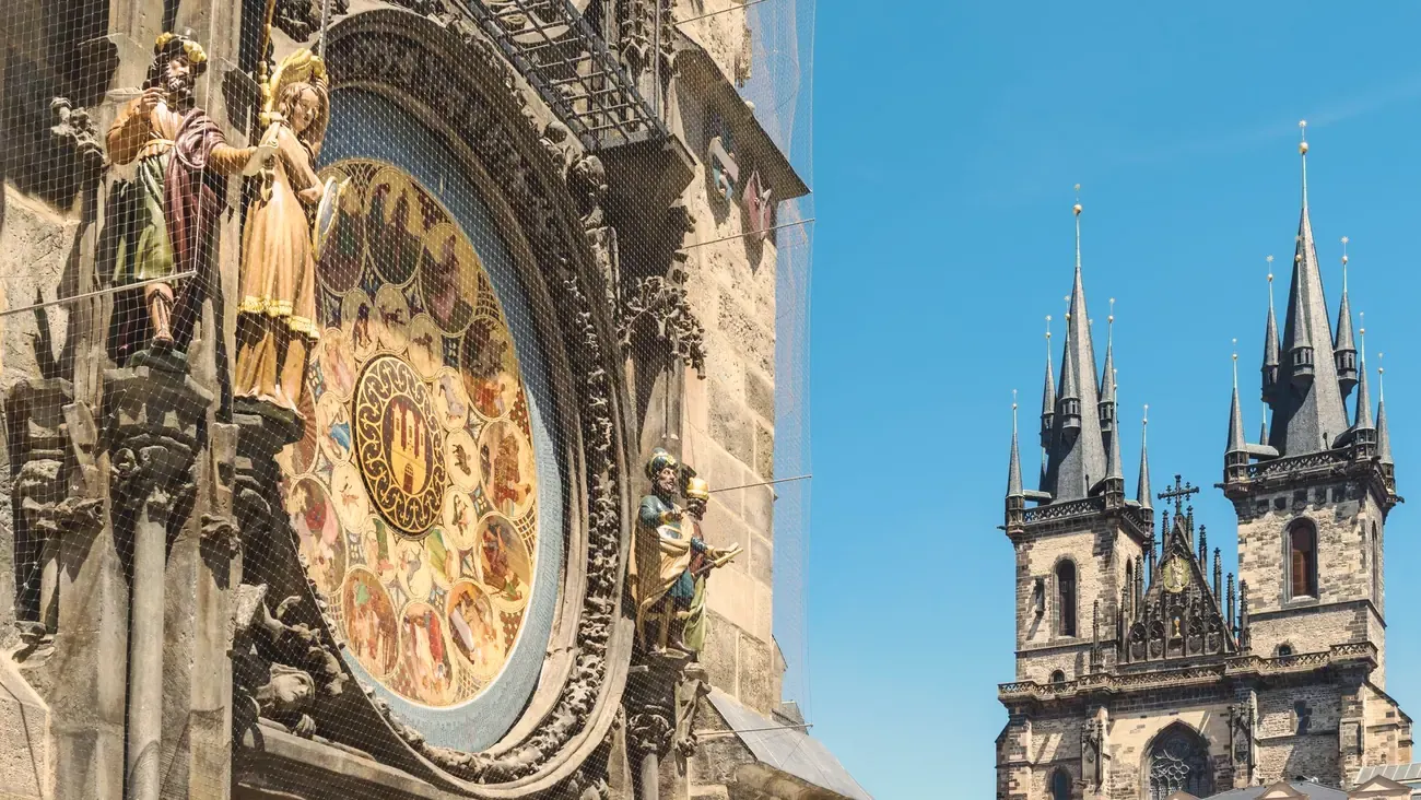 The Prague astronomical clock with the spires of Tyn Church behind