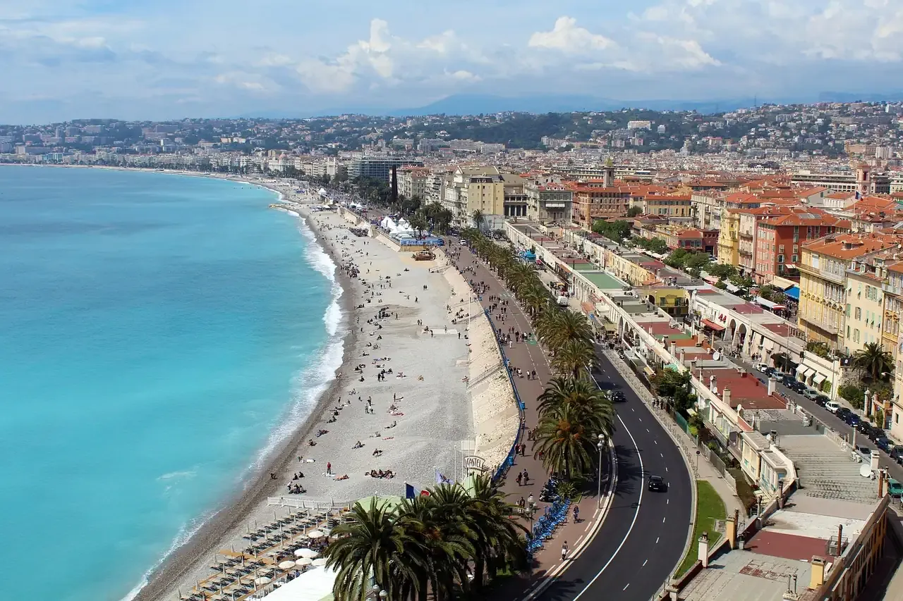 The Promenade des Anglais curving along the Bay of Angels in Nice, French Riviera