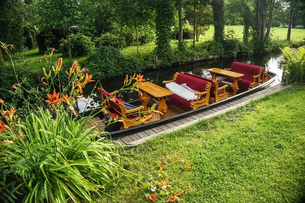 Flat wooden punts moored on a canal in the Spreewald
