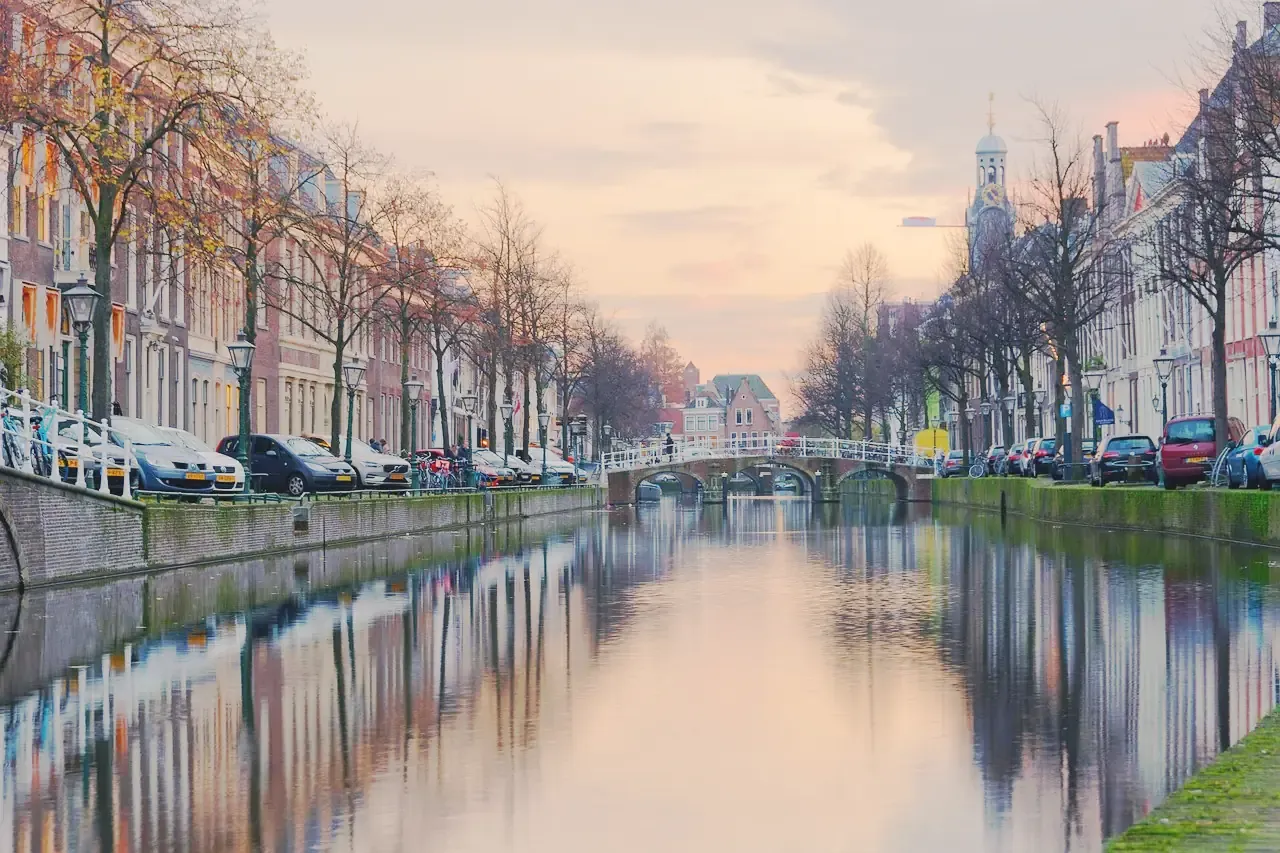 The Rapenburg canal in Leiden at sunset, lined with historic canal houses, Netherlands