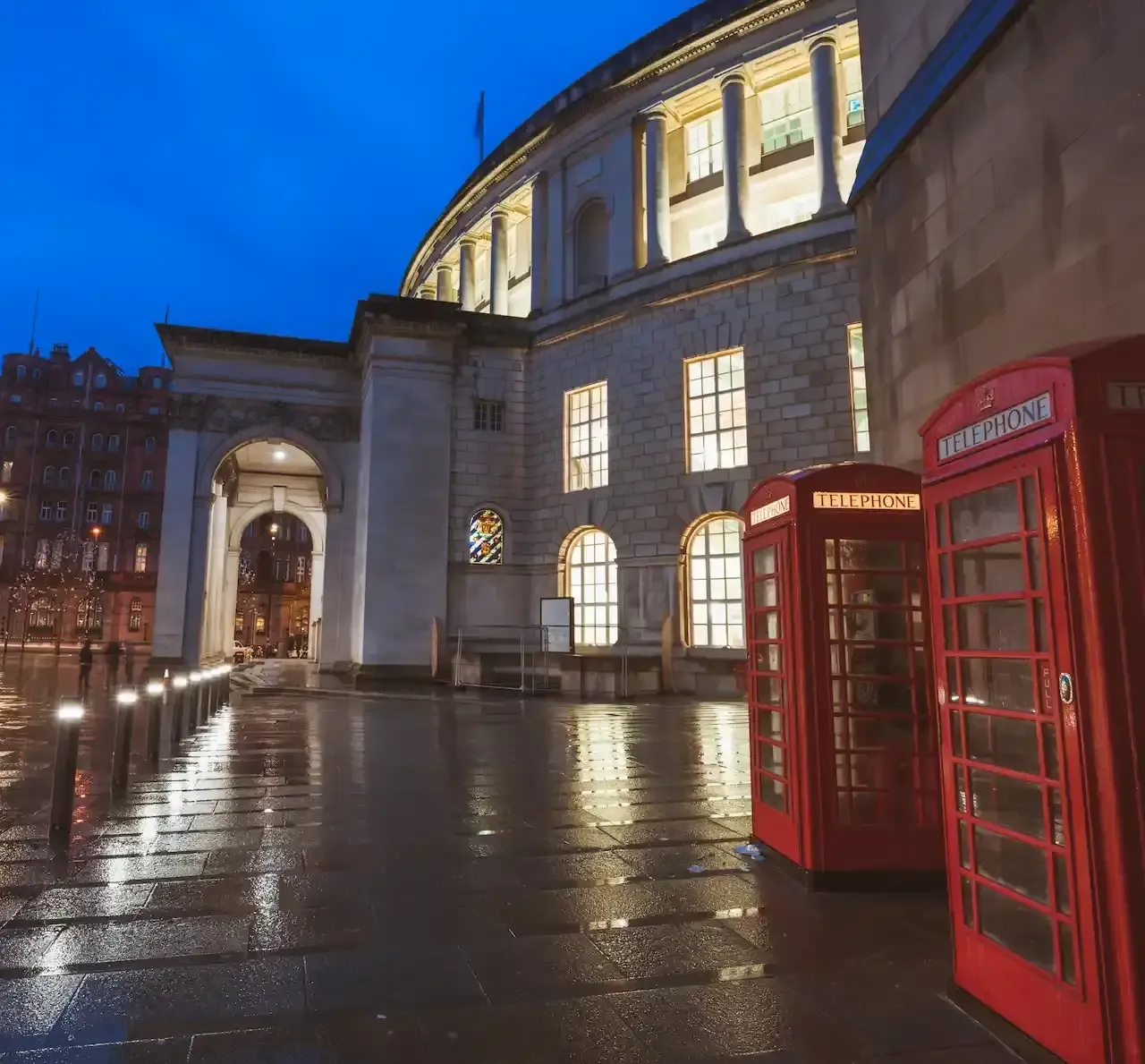 Red phone boxes near Manchester Central Library