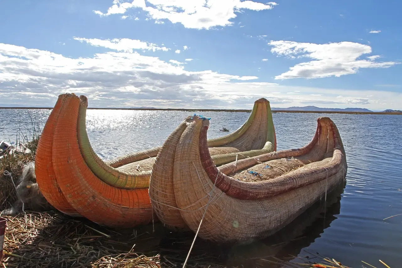 Totora reed boats drawn up on the shore of Lake Titicaca, Peru